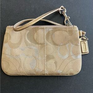 Coach Wristlet. Gold signature canvas with metallic silver and gold C’s